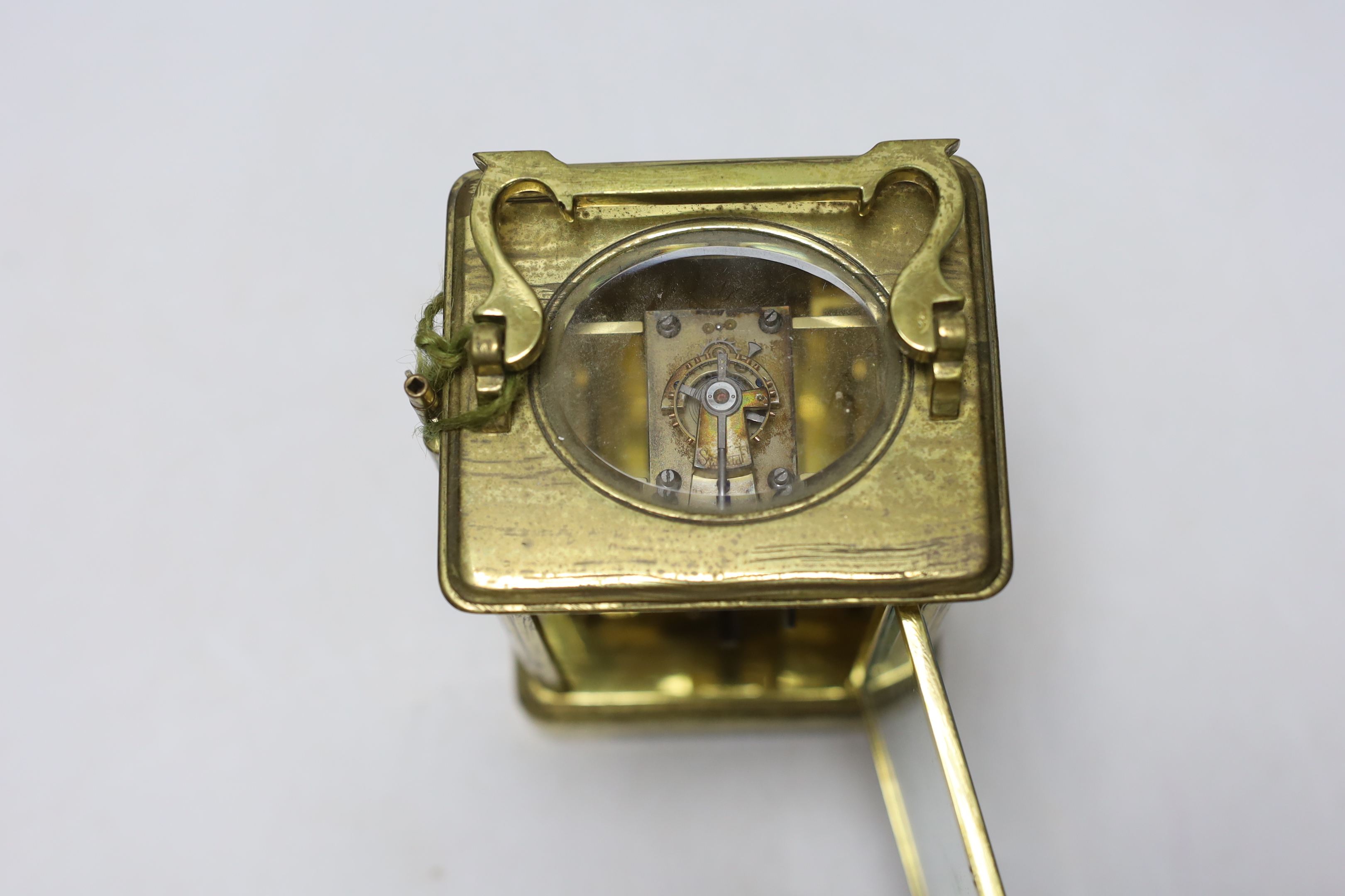 A brass carriage timepiece with enamel dial, 18cm high